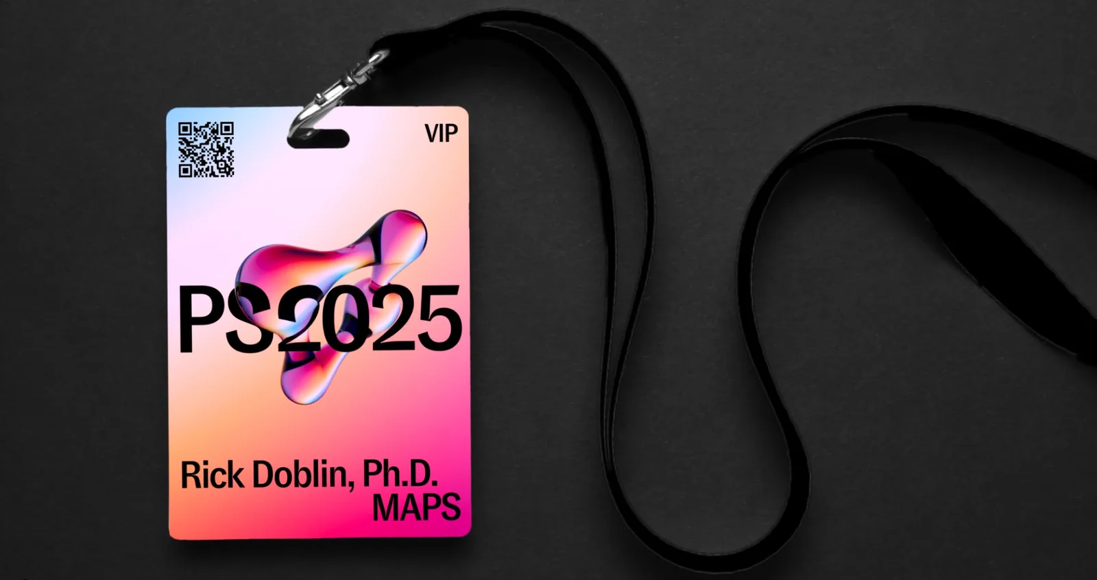 A VIP badge on a black lanyard: PS2025 through a magenta molecule, the attendee name and MAPS